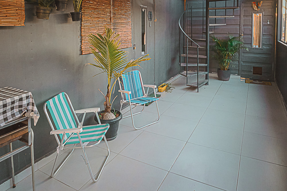 Communal terrace with chairs and spiral staircase